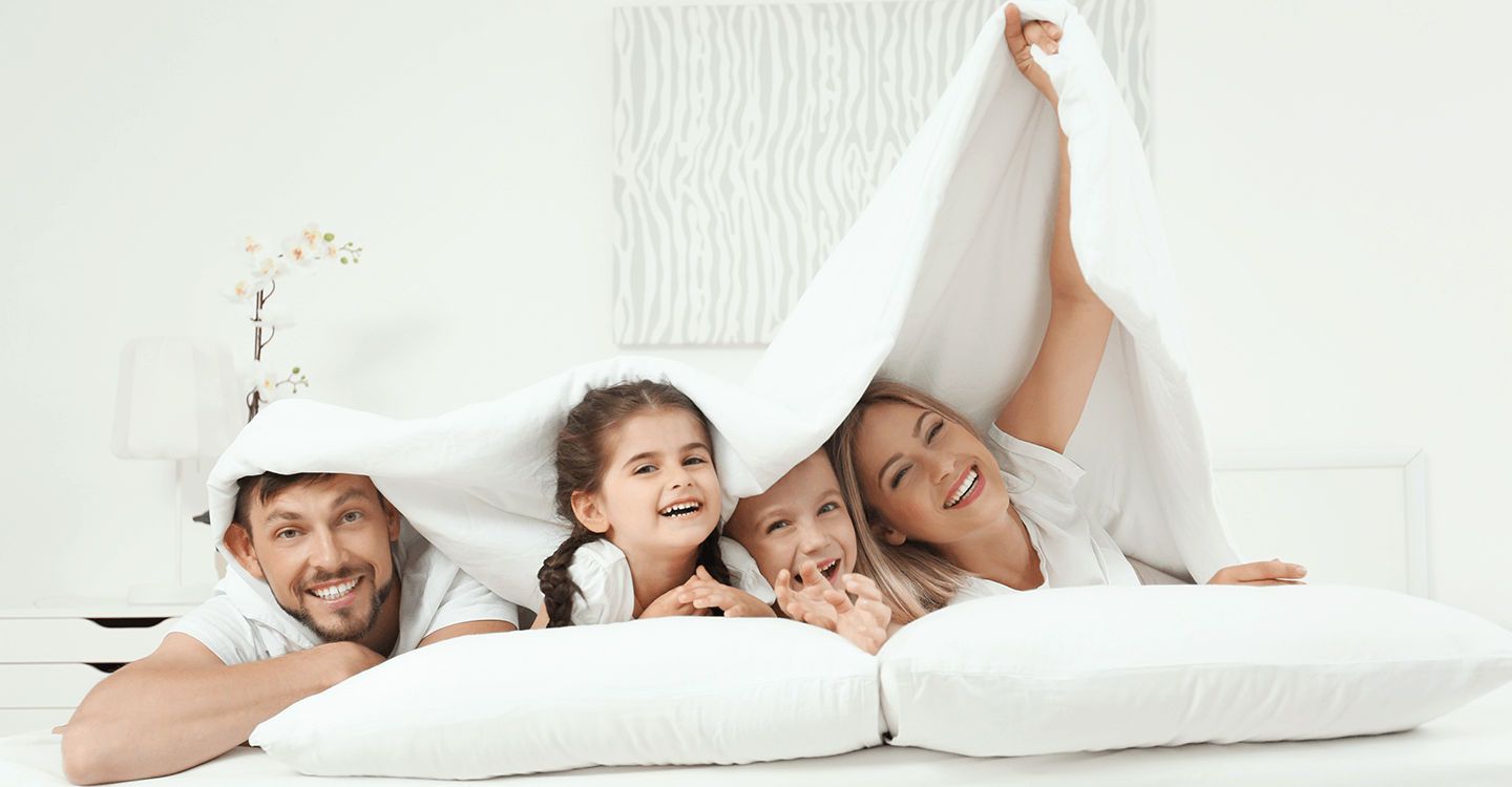 Happy family on vacation under gravity blanket